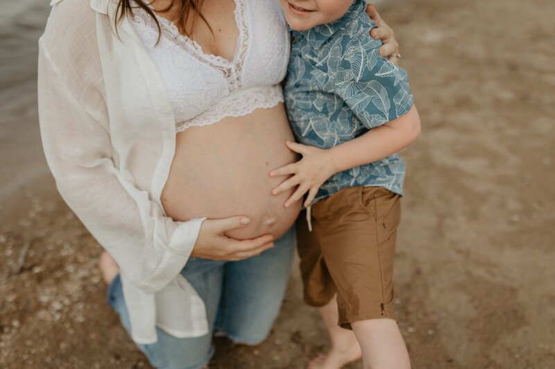 maternity photos at the beach with her first born