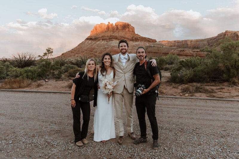 bride and groom with their photographer