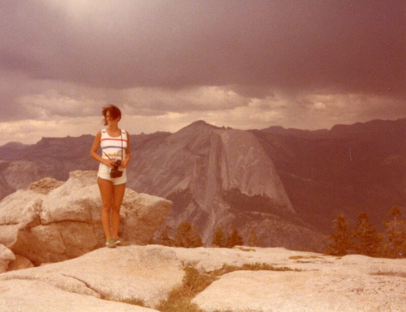 1970's woman skiing down a snowy slope