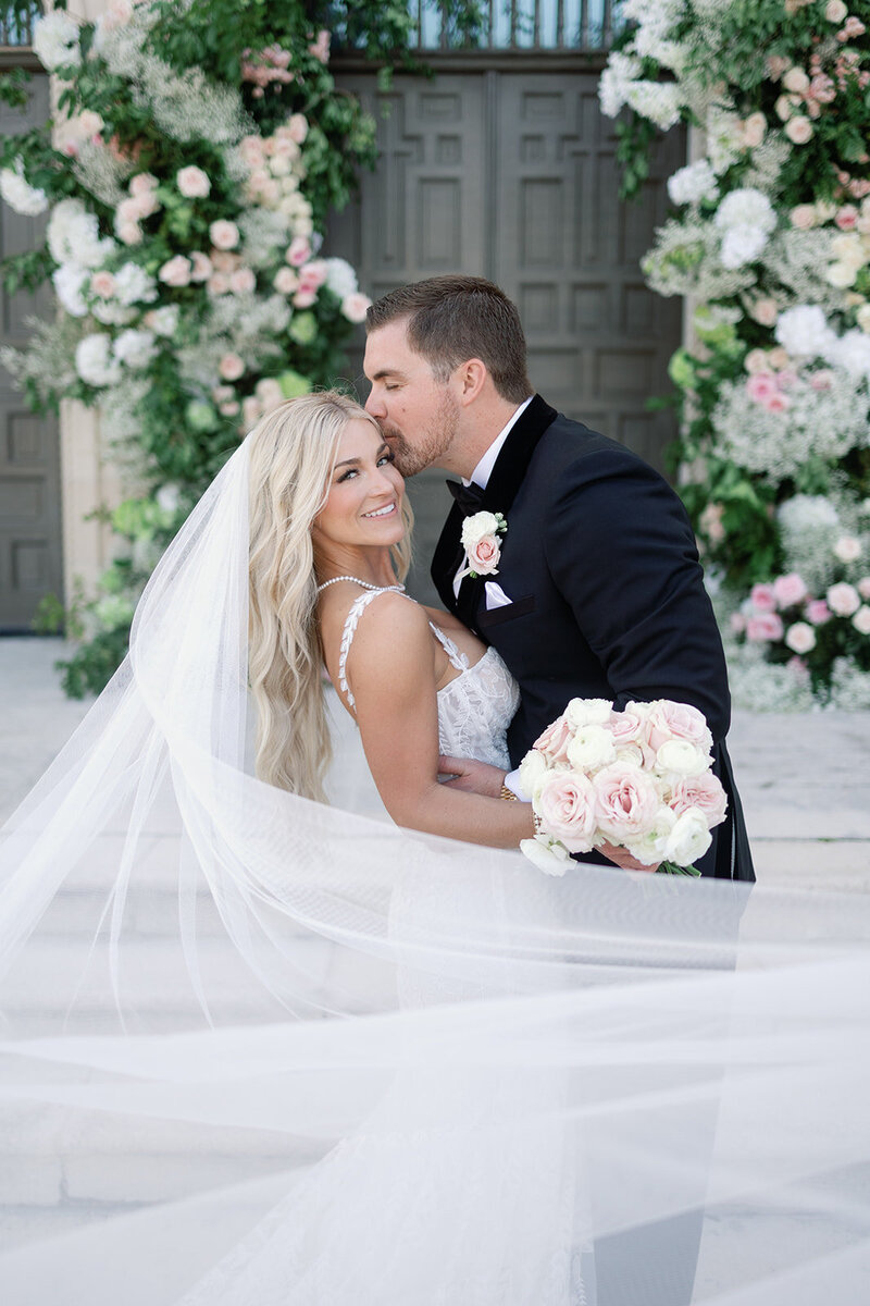 Beautiful elegant floral arch created by Ellie's garden for this stunning couple's wedding day at the Colony Hotel