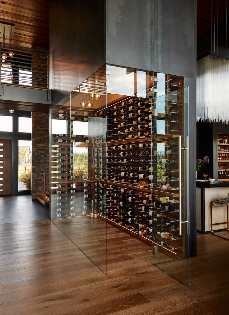 mountain-modern-wine-room-steel-panel-glass-wall