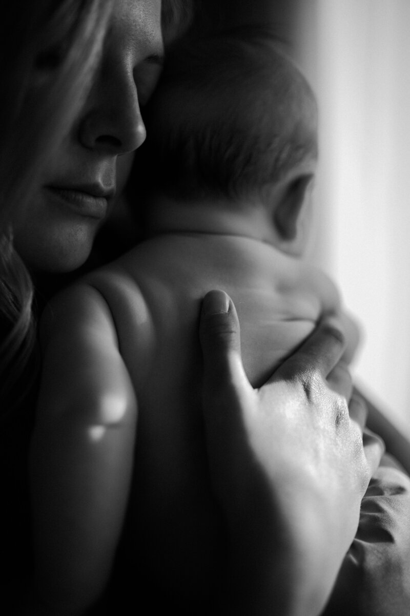 black and white image mother holding baby