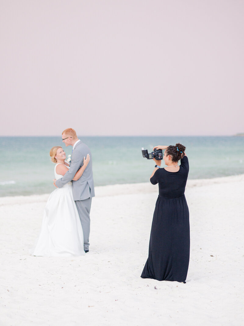 Christine Hazel Photography photographing a couple on the beach