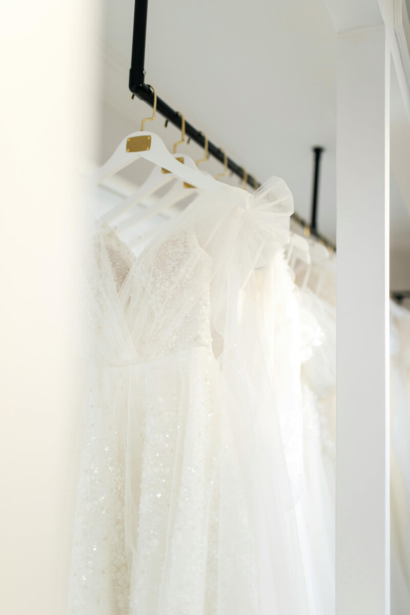Dresses on Hangers | Emmanuel's Bridal