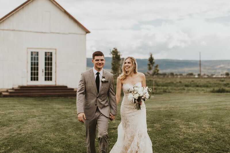 Wedding ceremony with barn backdrop