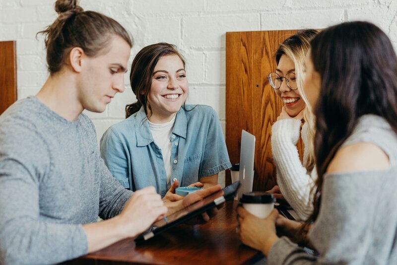 a group of people collaborating at a table 