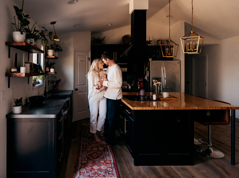 couple standing in kitchen in St. Louis home during a photography session