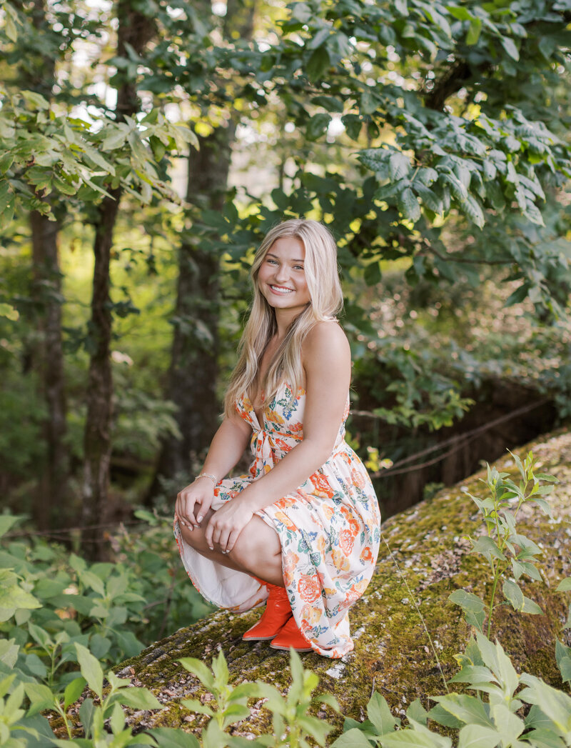 A girl smiling at the camera during her senior pictures in Columbus, Georgia.