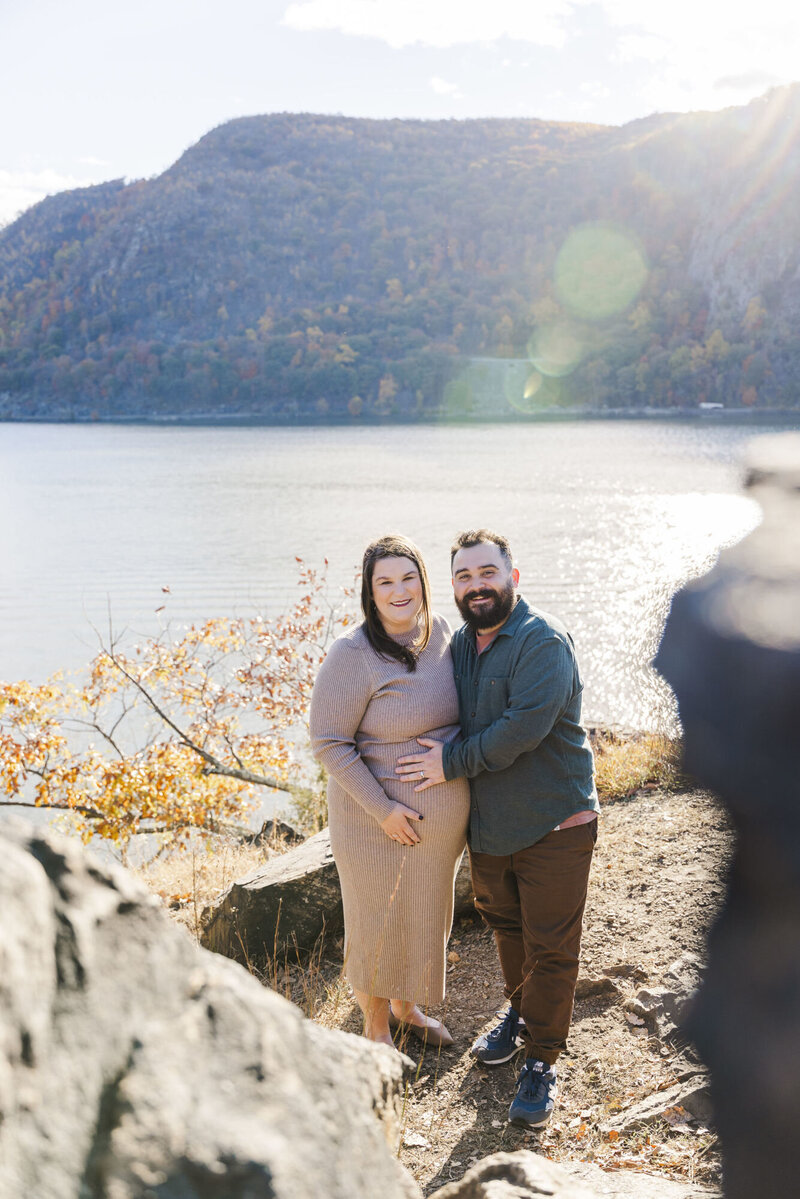 Authentic Hudson Valley maternity photos in Beacon with candid hugs and real emotion