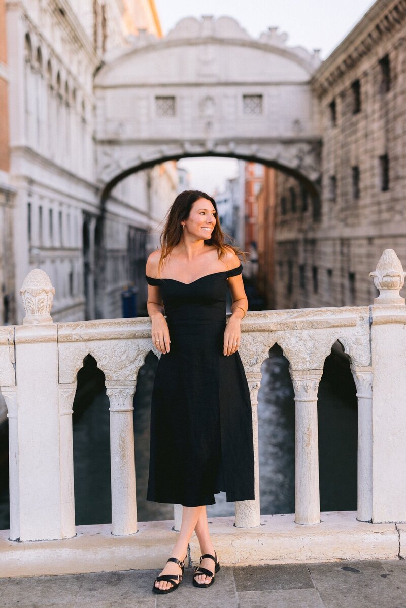 Windows on Travel founder Alexis Smith in Venice Italy in front of  the famous Bridge of Sighs.