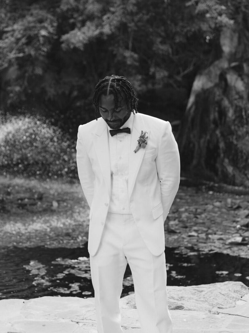 groom wearing all white gucci suit
