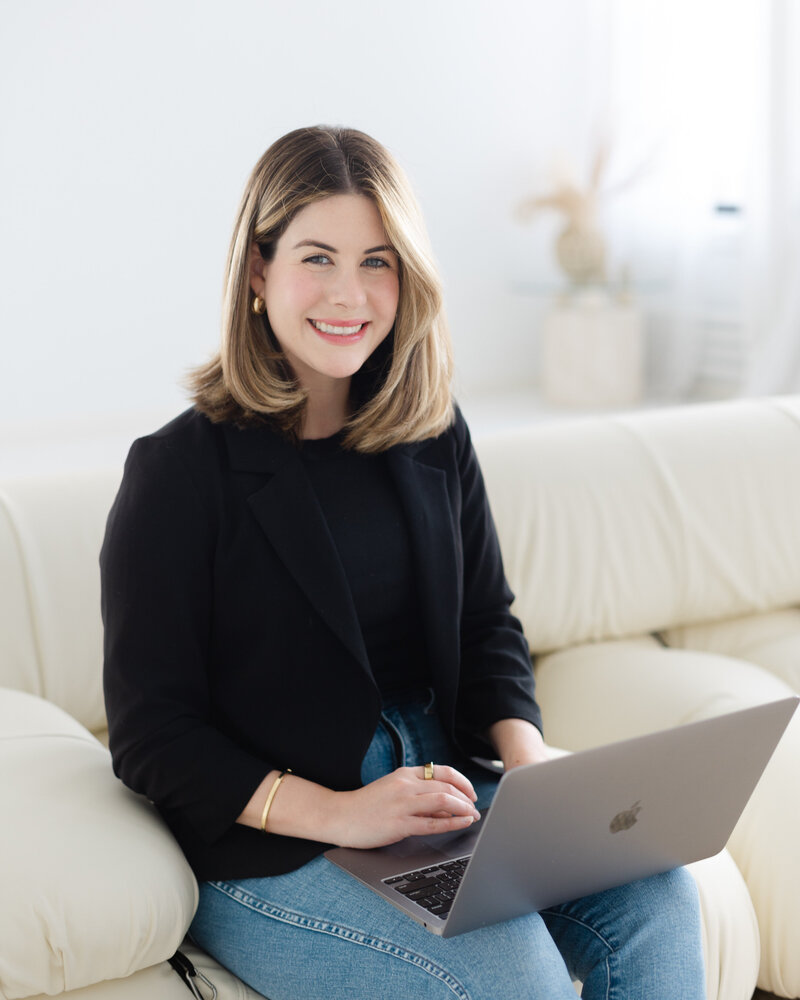 Executive coach in her laptop doing some client leadership development goals and action plans