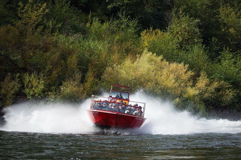 red jet boat on the water