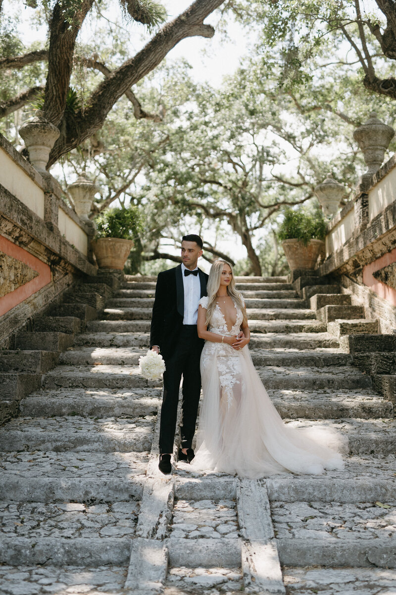 couple posing at vizcaya gardens in miami