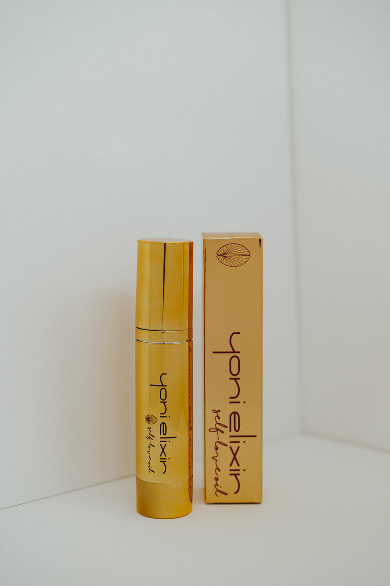 Yoni Elixir in gold packaging displayed