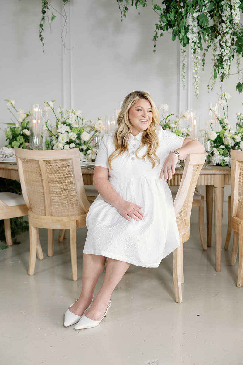 woman smiling sitting at desk