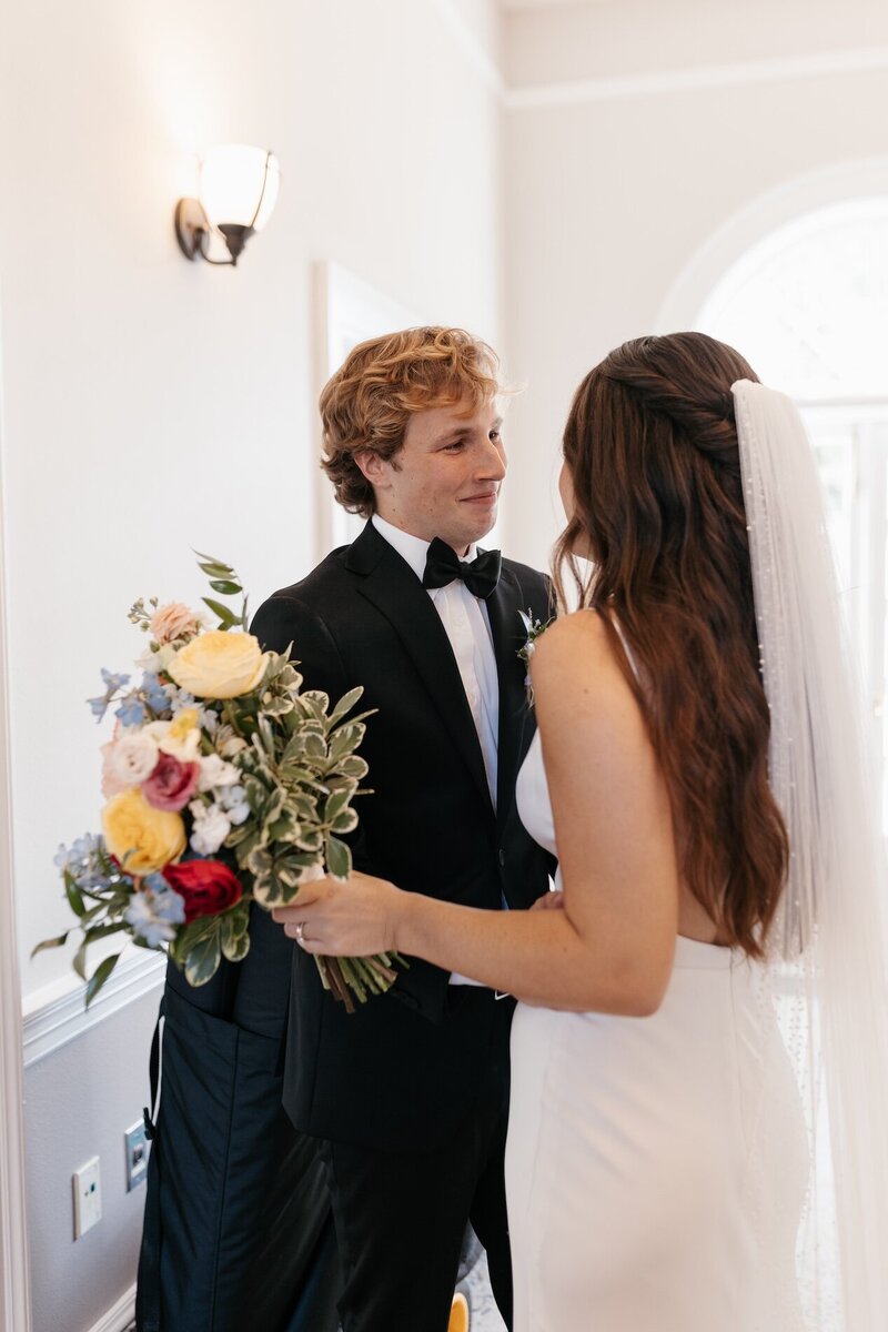 bride and groom embracing on wedding day