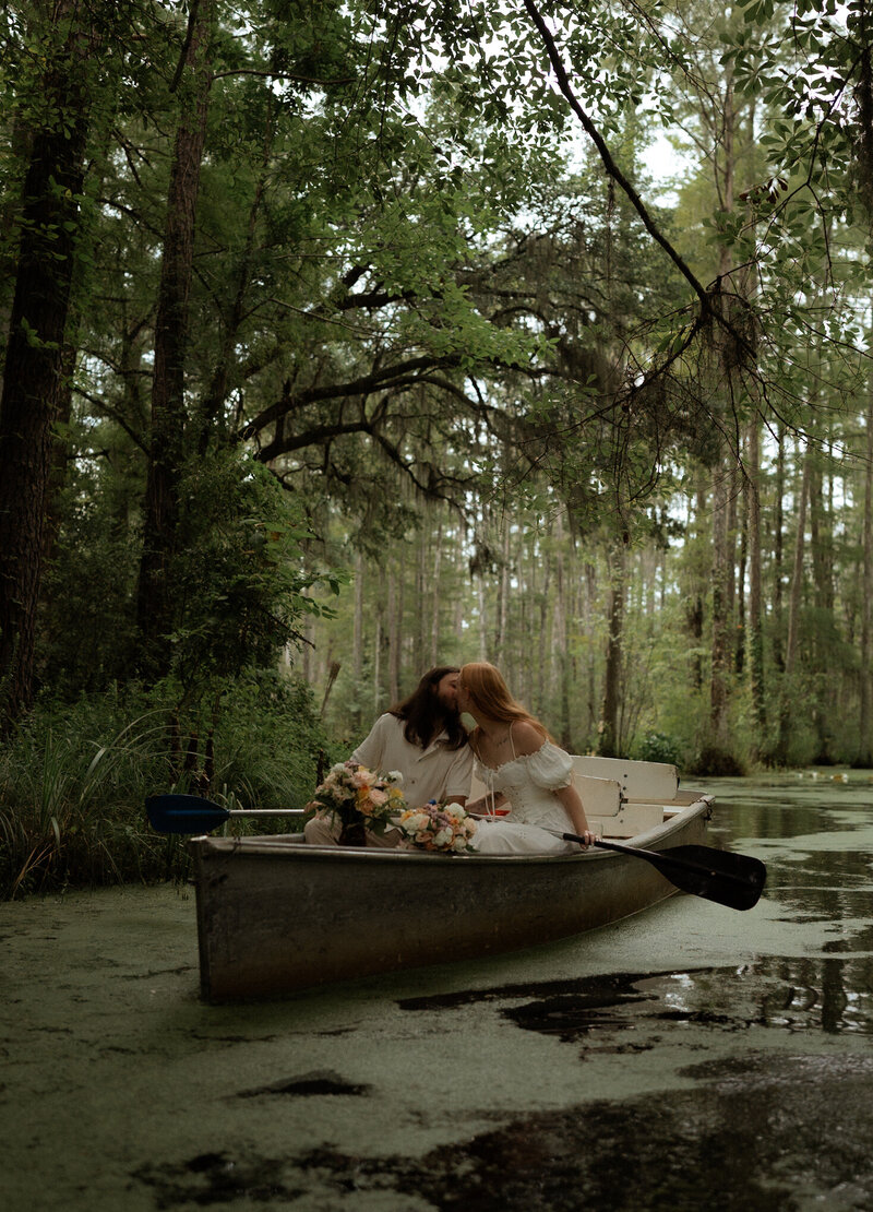 couple eloping on a boat in Cypress Gardens of Charleston South Carolina