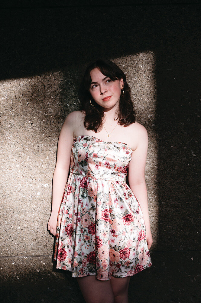 Senior portrait session by a Pittsburgh senior photographer, featuring natural candid expressions and a pink-tinted sky. Professional Pittsburgh PA senior pictures capturing authentic moments and warm golden hour lighting.