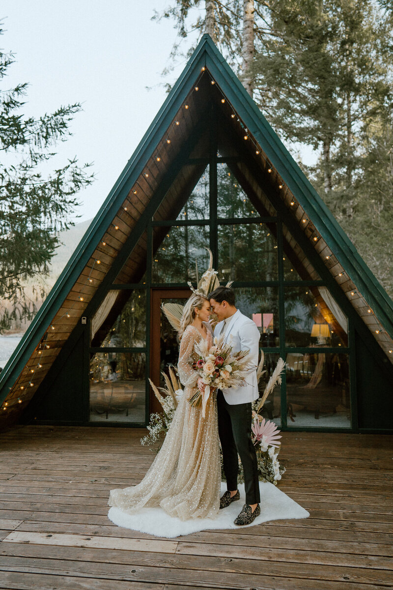 elopement bride and groom near cabin