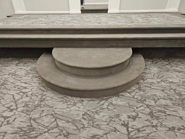 Close-up of light gray patterned carpet.