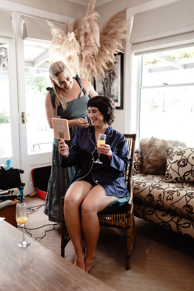 Naomi doing final touches on the hair