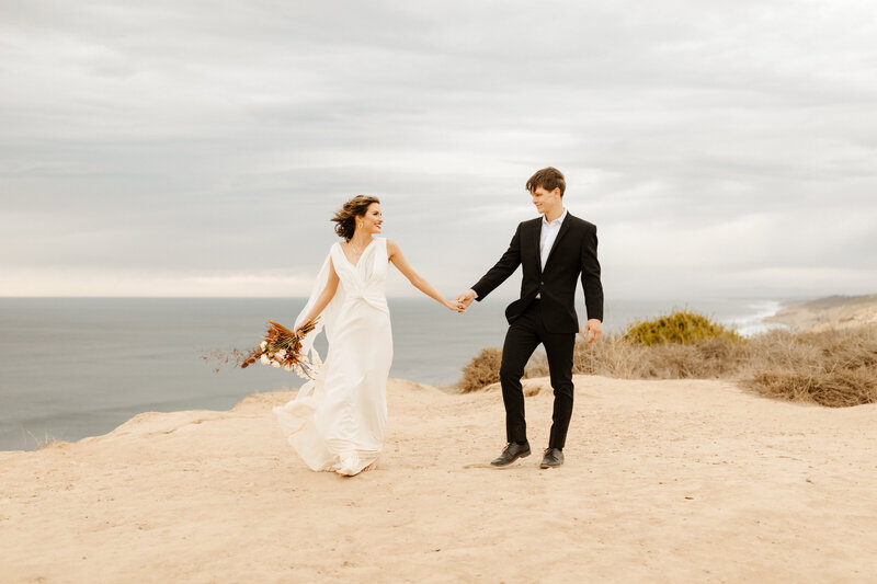 bride and groom at cliffside wedding in Laguna Beach