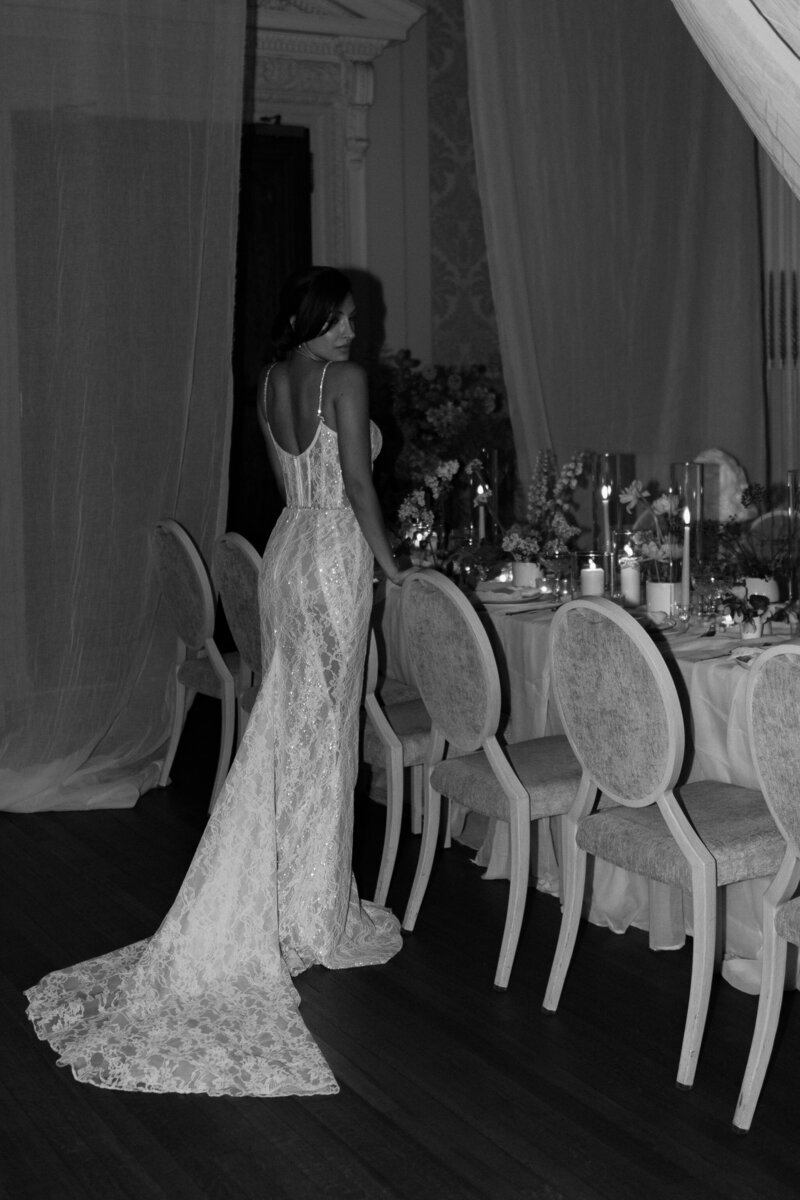 Wedding photographer captures couple taking a stroll hand in hand at their french chateau wedding.