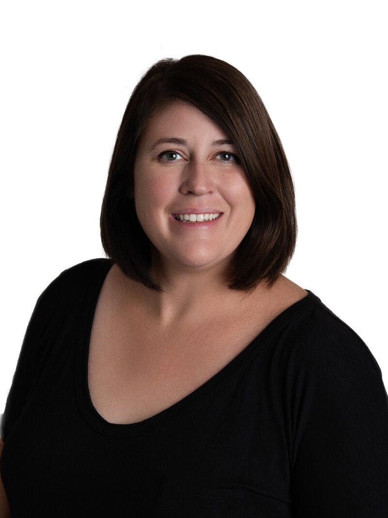 Megan Bogart outside smiling at camera with text "Hey there" across the image