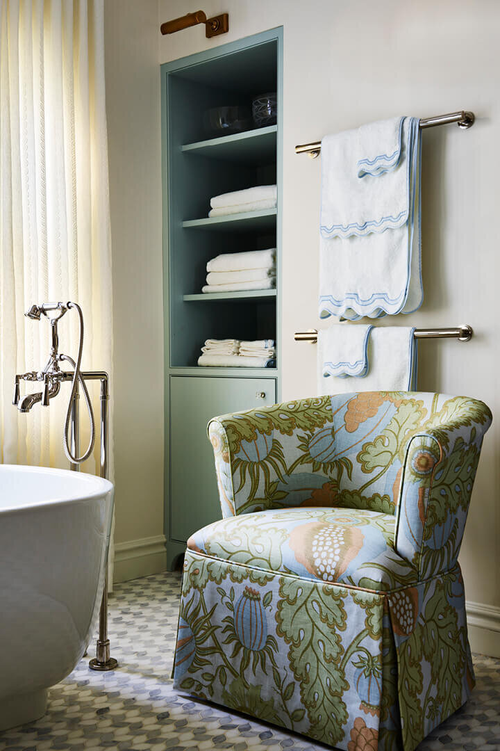 Best interior designers in Boston renovate a Milton bathroom with a Kallista tub and a Christopher Farr Cloth slipper chair for a refined classic look.