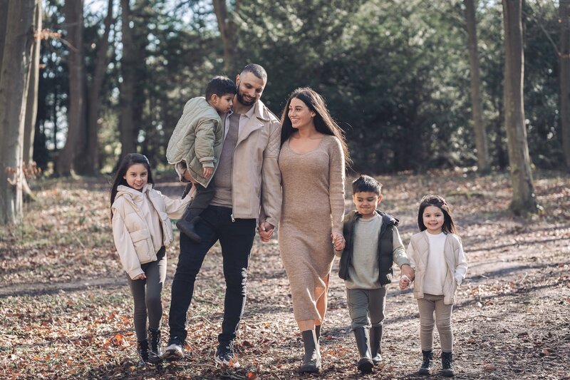 family walking through woods