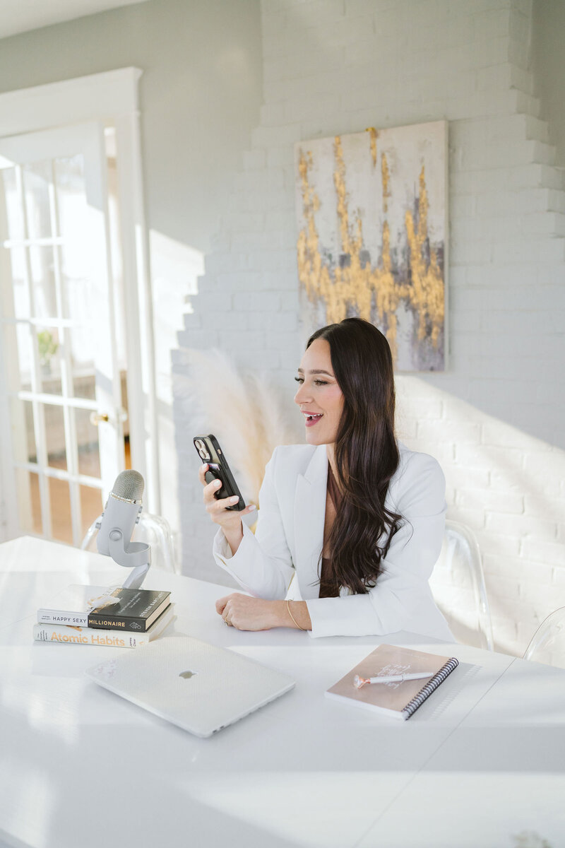 kat holding phone on hand