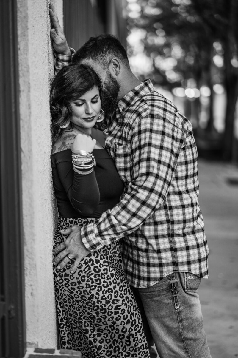 timeless  and romantic engagement couples pose in downtown Lafayette, Louisiana