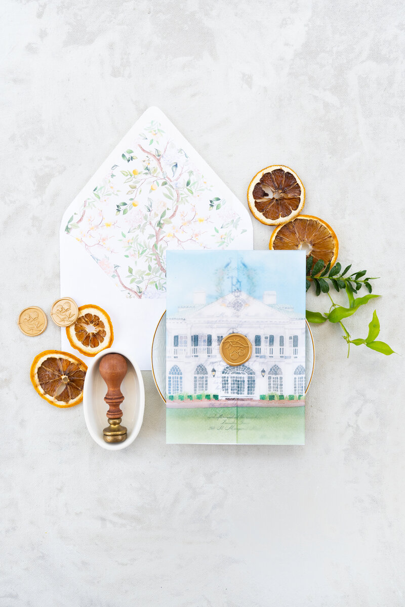 Watercolor chinoiserie envelope liner with a vellum wrap. Watercolor illustration of Lowndes Grove. Gold wax seal. Photo by Peterson Design & Photo