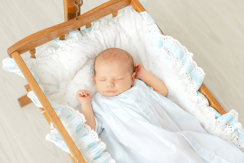 newborn baby girl sleeping on a white heirloom blanket in Savannah, Ga Constance calton photography