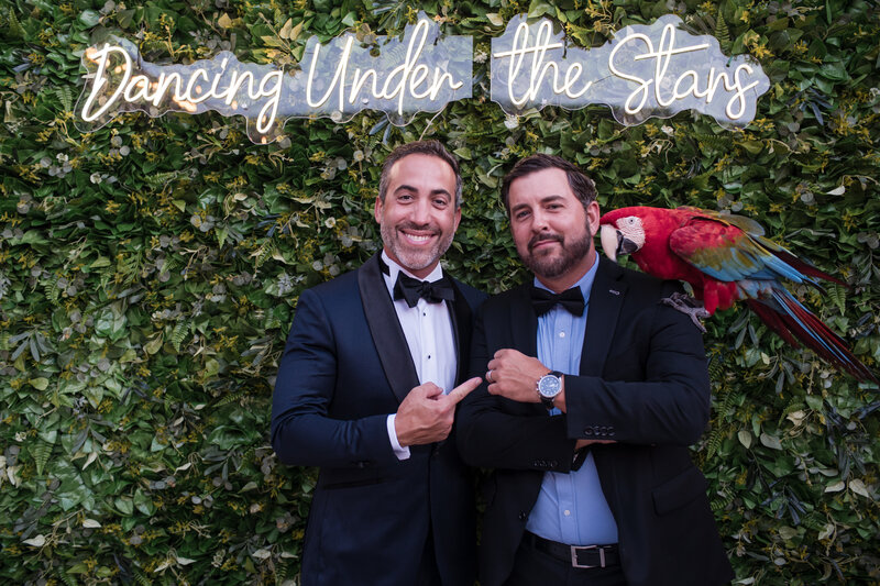 Event photography man with a parrot on his shoulder