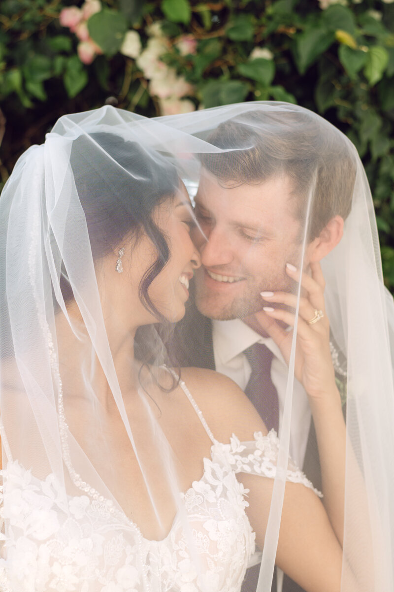 Bride and Groom veil photo with ring Bella Cosa Venue Lake Whales Florida