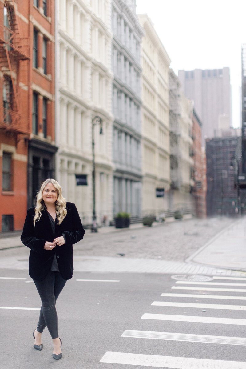 Photographer Michelle Jackson standing in the streets of New York City