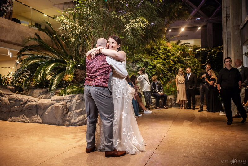 Couple dance on the first floor of Marnie's Pavilion on their wedding day at Denver Botanic Gardens