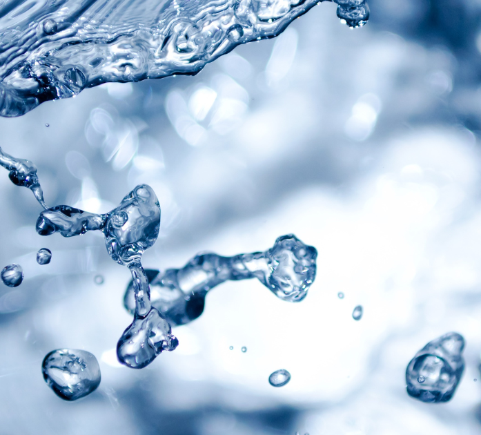 Water background symbolizing hydration benefits of Hydrate Blend IV Vitamin Therapy at Refined Medical NY in East Setauket, Long Island.