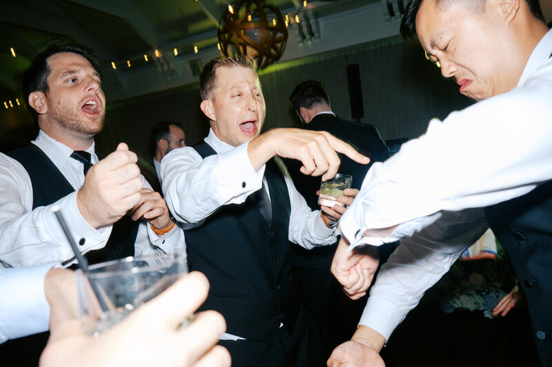 Maids of honor laughing on dance floor Glen Foerd Estate in Philadelphia, PA
