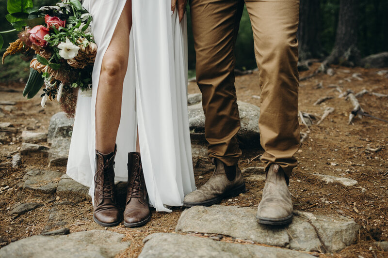 elopement couple in woods wearing boots