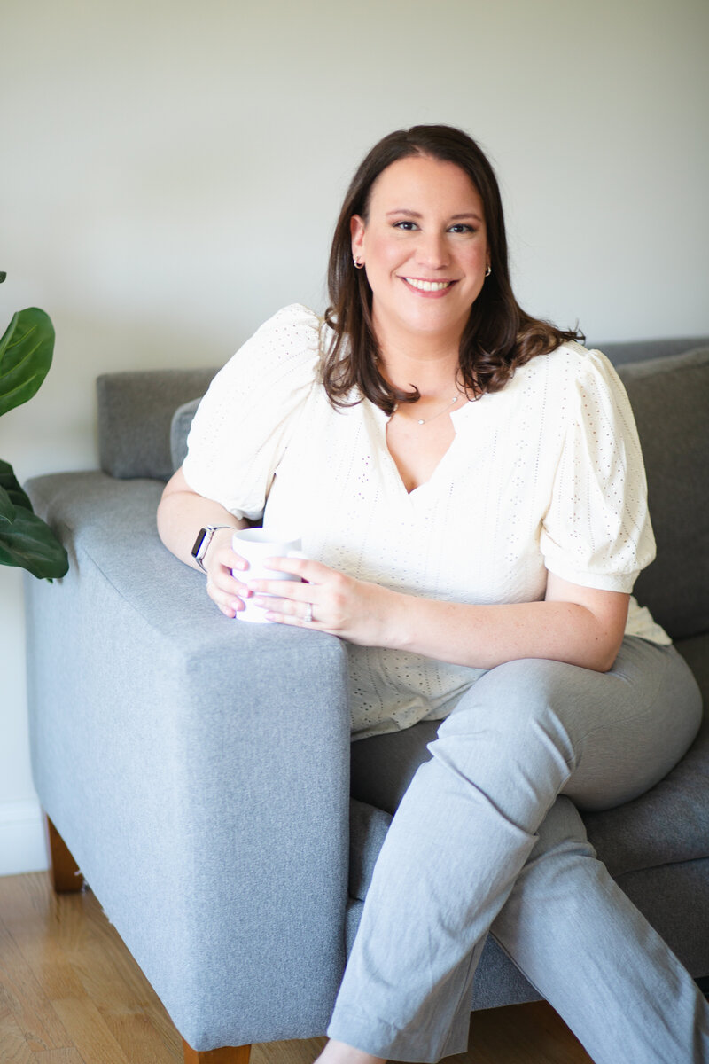 Therapist Sarah Choffnes holding coffee