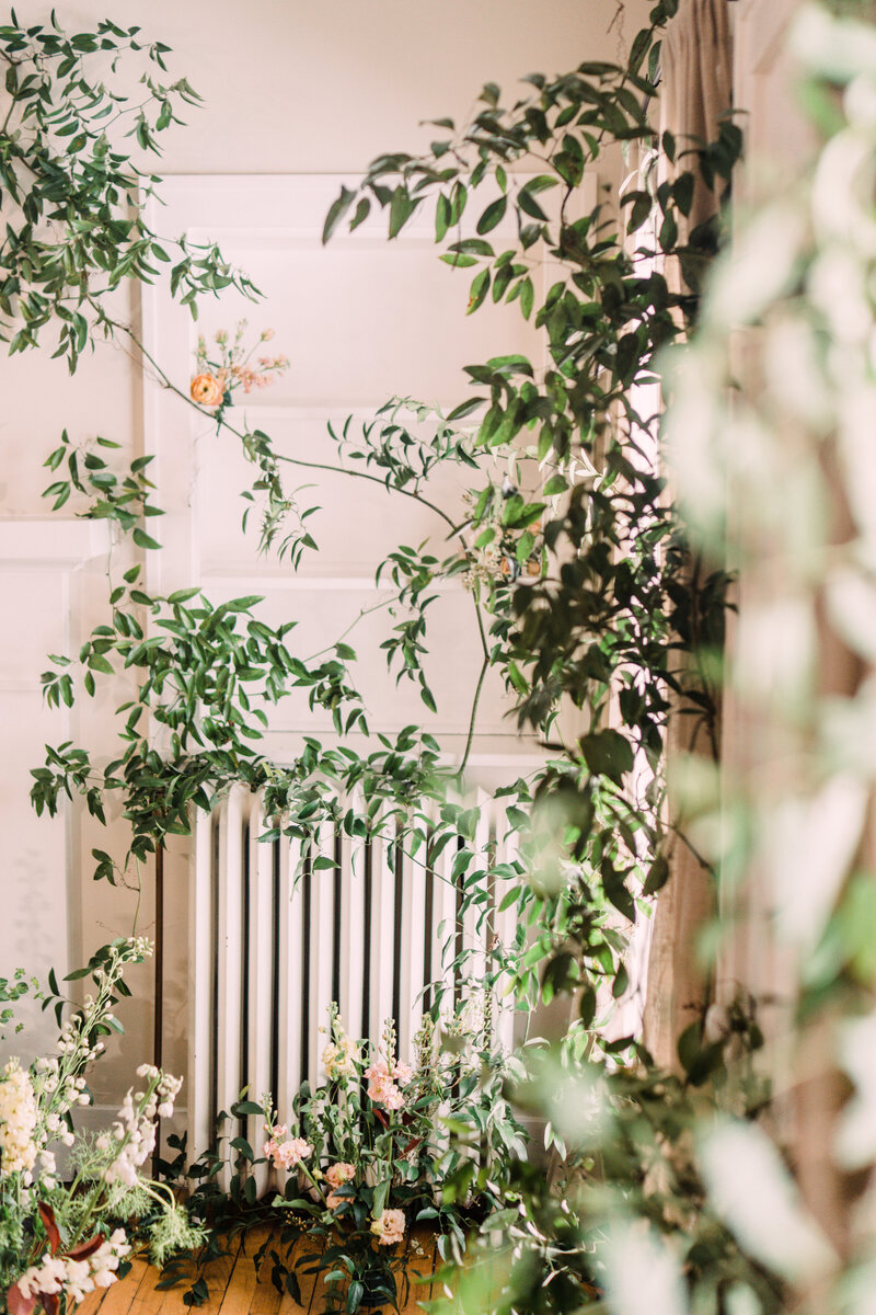 Radiator covered in flowers & vines at Zingerman's Cornman Farms for the spring & summer tiny weddings