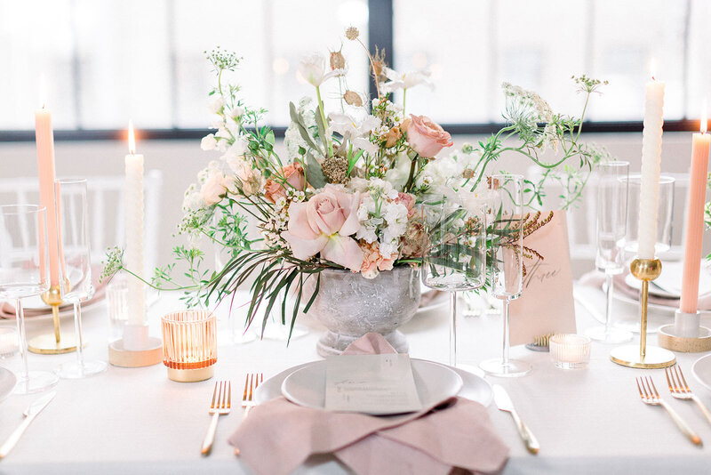 Blush & white floral centerpiece at wedding reception