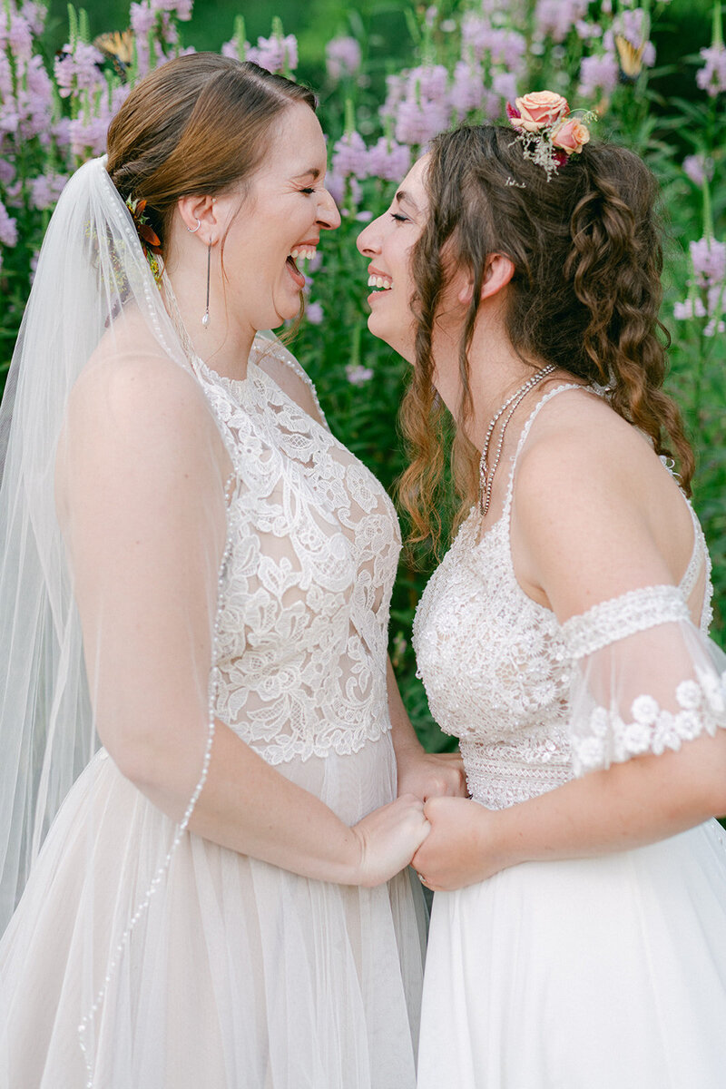 Two brides laughing at Sunnyside at Baldwin Farms