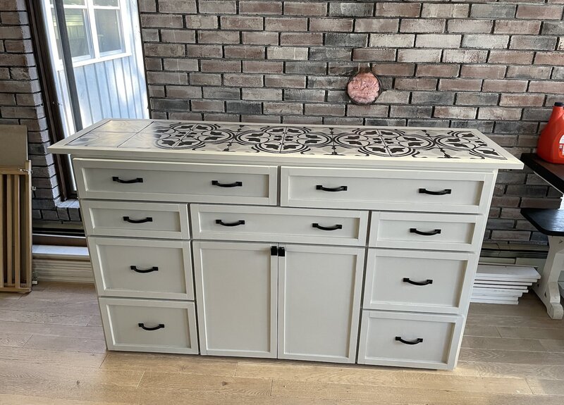 a wooden dresser that has been refurbished