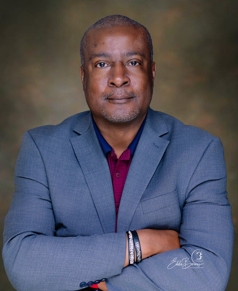 Professional headshot portrait of an African American man in a patterned shirt captured in studio by Tytanium3 Photography, Simpsonville and Greenville SC photographer
