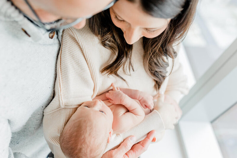 Mom and dad gaze down at their baby at Boston Children's Hospital