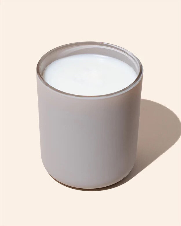 Noura Blanc Aura Candle in Stonewashed Large 12oz on flat lay